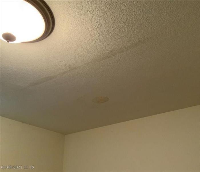 Water damage in a ceiling due to a roof leak 