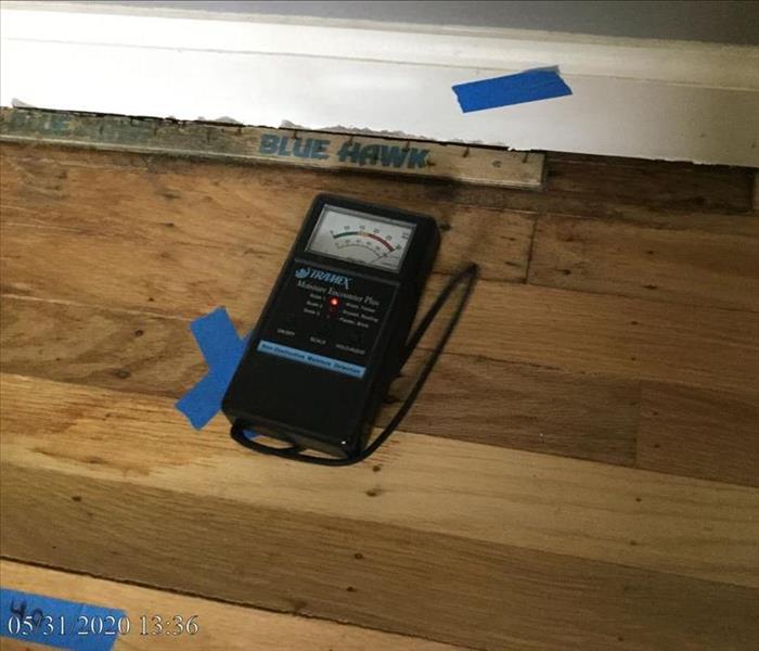 Picture of moisture reading on the floor