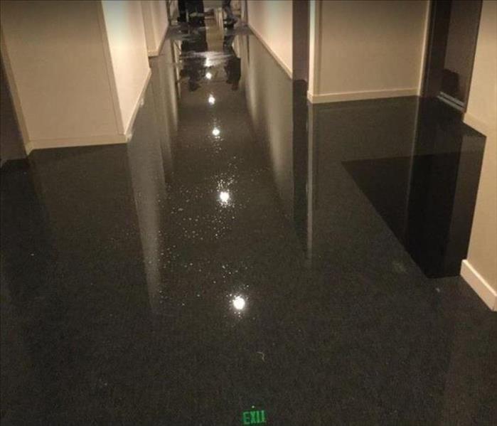 Standing water on floor of office building
