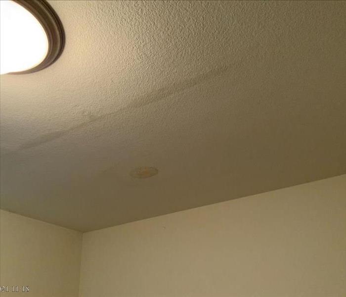 Water damage on a ceiling due to a roof leak