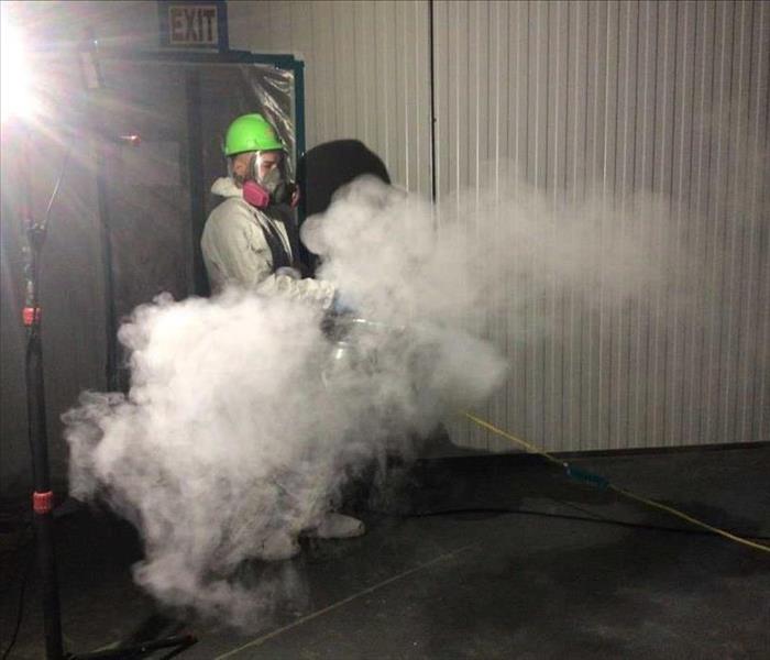 Our technician deodorizing a commercial building  